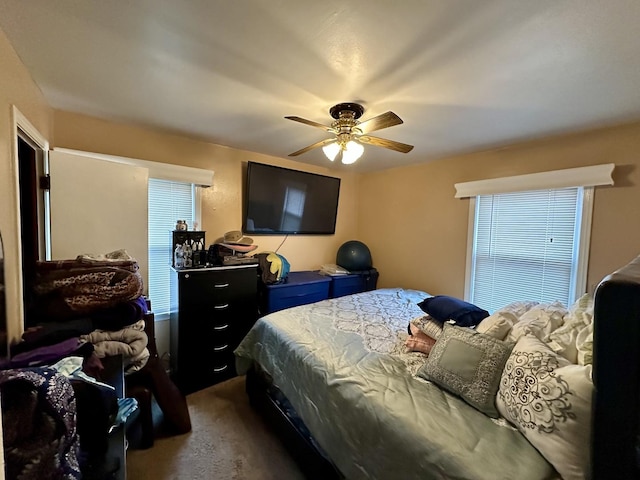 carpeted bedroom with ceiling fan