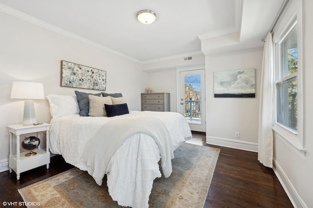 bedroom with crown molding, dark hardwood / wood-style flooring, and access to outside