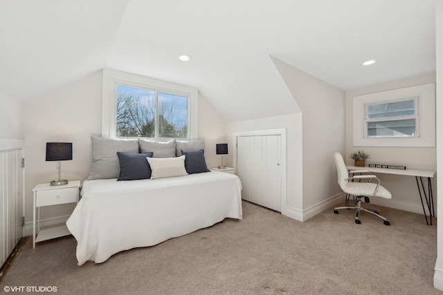 carpeted bedroom featuring lofted ceiling