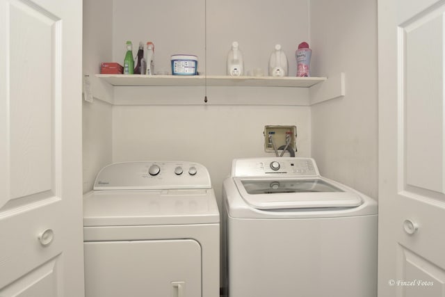 washroom featuring independent washer and dryer