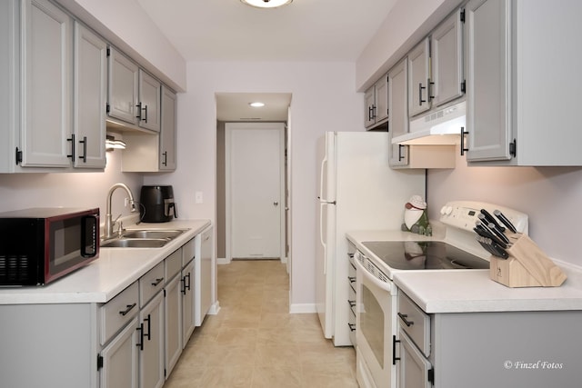 kitchen featuring gray cabinetry, sink, and white appliances