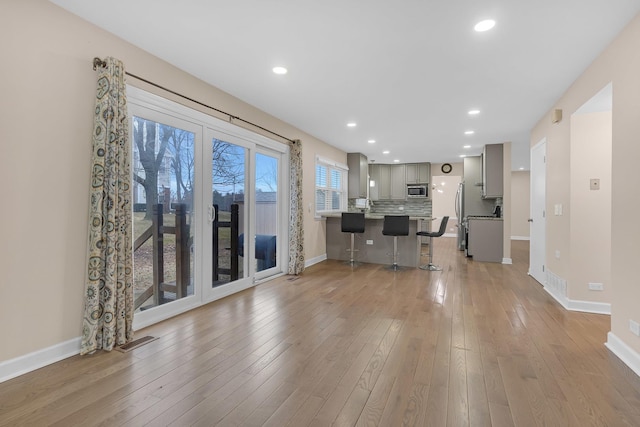 unfurnished living room with light hardwood / wood-style floors