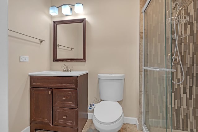 bathroom with vanity, toilet, and walk in shower