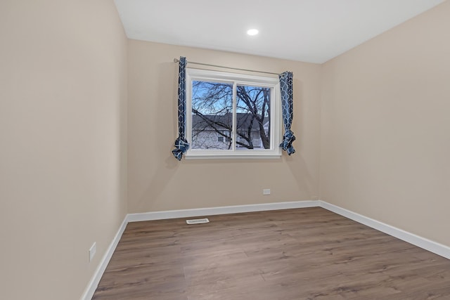 empty room with wood-type flooring