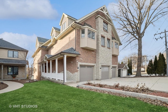 view of front of house with a garage and a front lawn