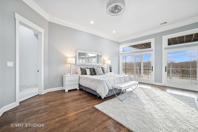 bedroom with crown molding, dark hardwood / wood-style floors, and access to outside