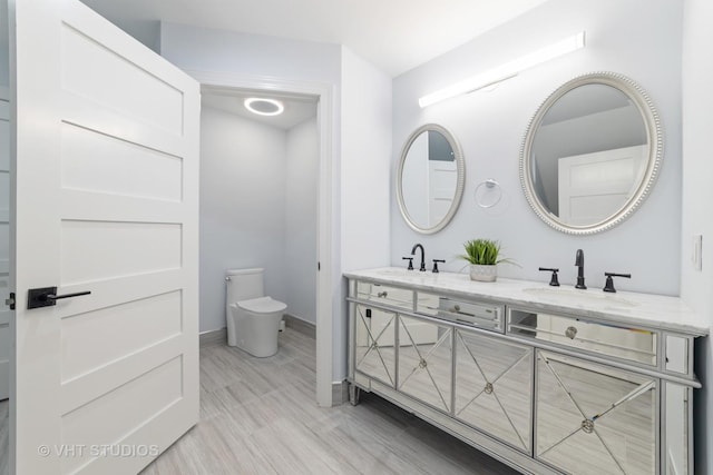 bathroom with vanity and toilet