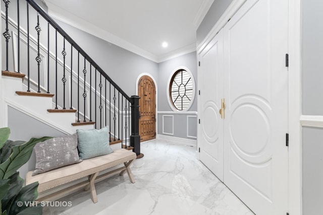 entrance foyer featuring crown molding