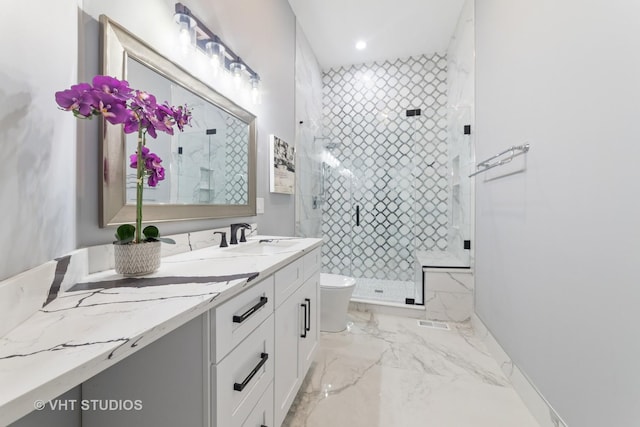 bathroom featuring vanity, an enclosed shower, and toilet