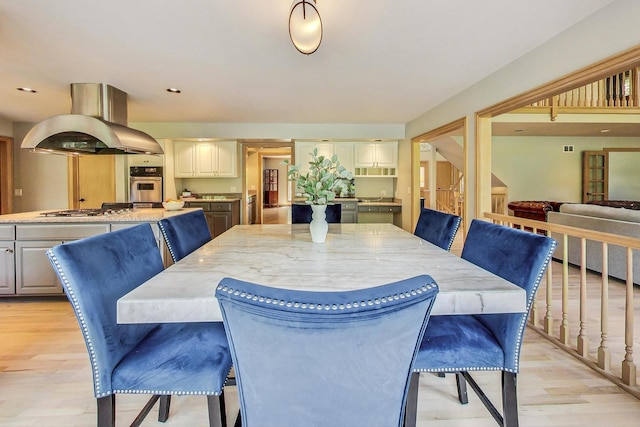 dining space featuring light hardwood / wood-style floors