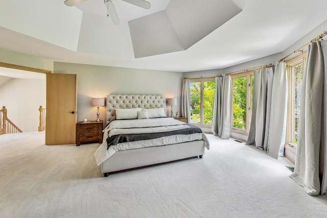 carpeted bedroom with lofted ceiling and ceiling fan