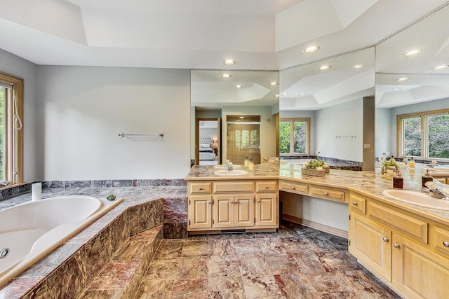 bathroom with vanity and plus walk in shower