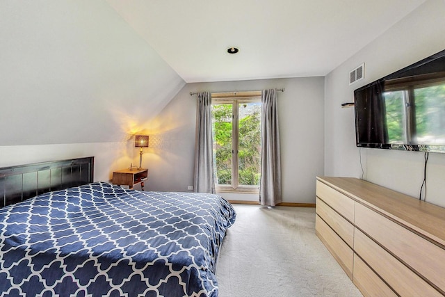 carpeted bedroom with vaulted ceiling