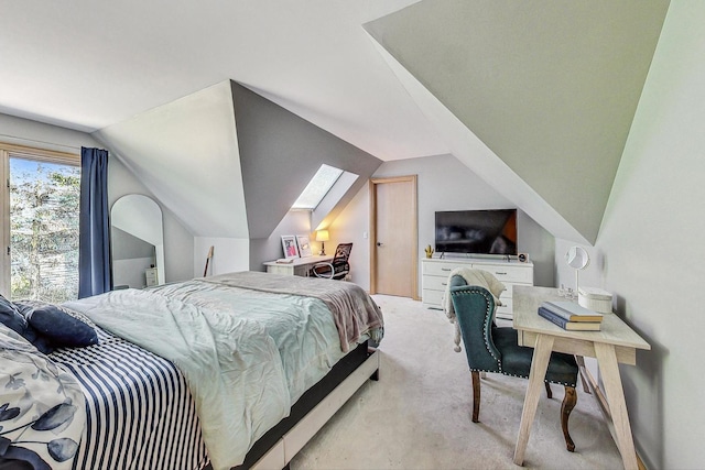 bedroom featuring lofted ceiling and light carpet