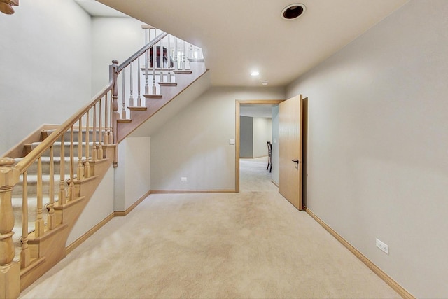 stairs with carpet flooring