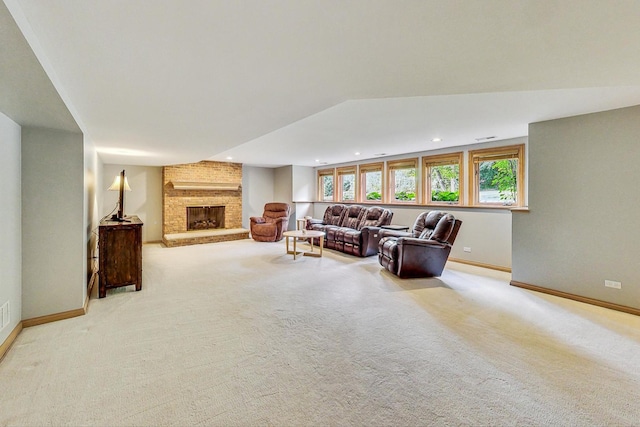 living room with light colored carpet and a fireplace