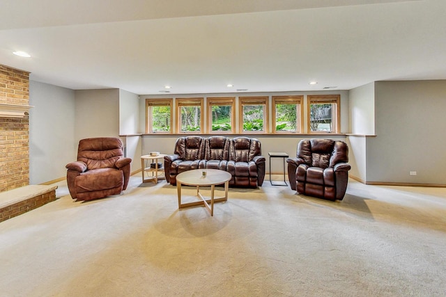 living room with a fireplace and light colored carpet