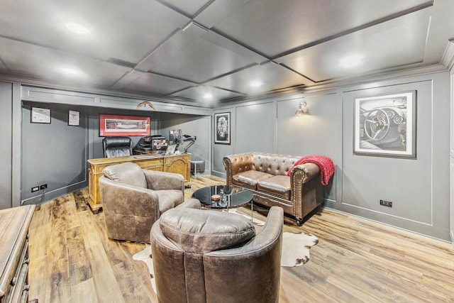 home theater with coffered ceiling and light hardwood / wood-style floors