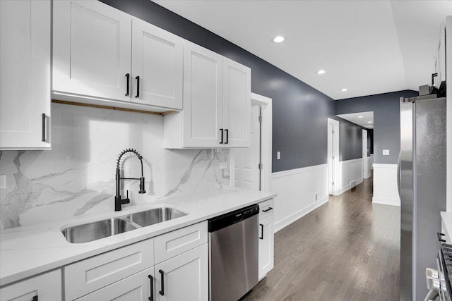 kitchen featuring white cabinetry, appliances with stainless steel finishes, sink, and dark wood-type flooring