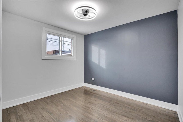 empty room featuring hardwood / wood-style flooring