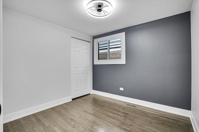 empty room featuring hardwood / wood-style floors