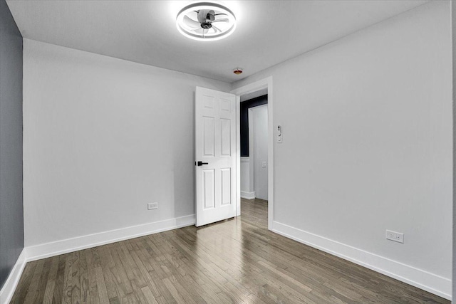 spare room featuring hardwood / wood-style floors