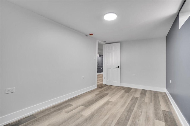 spare room featuring light hardwood / wood-style floors