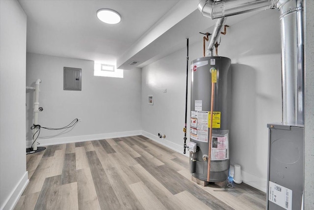 utility room featuring electric panel and gas water heater