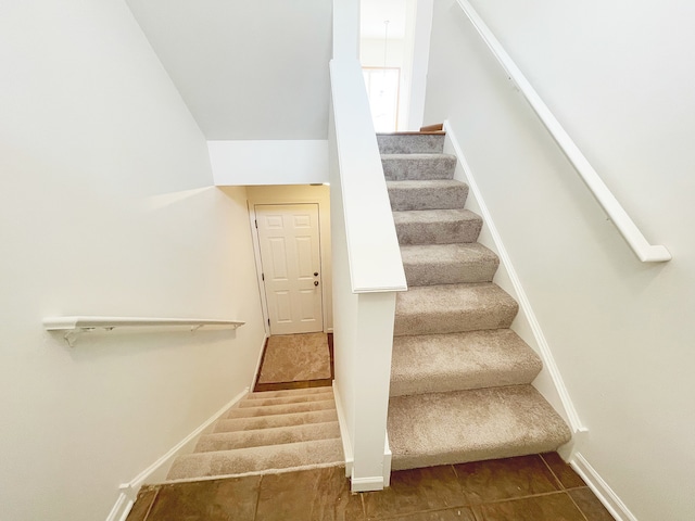 stairs featuring baseboards