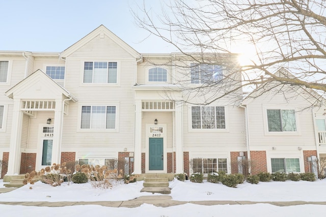 view of front of property featuring brick siding