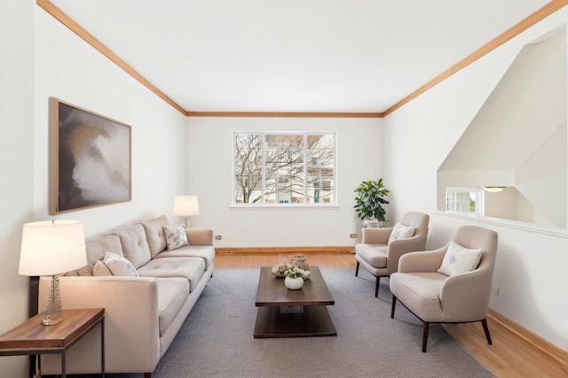 living room with baseboards, wood finished floors, and crown molding