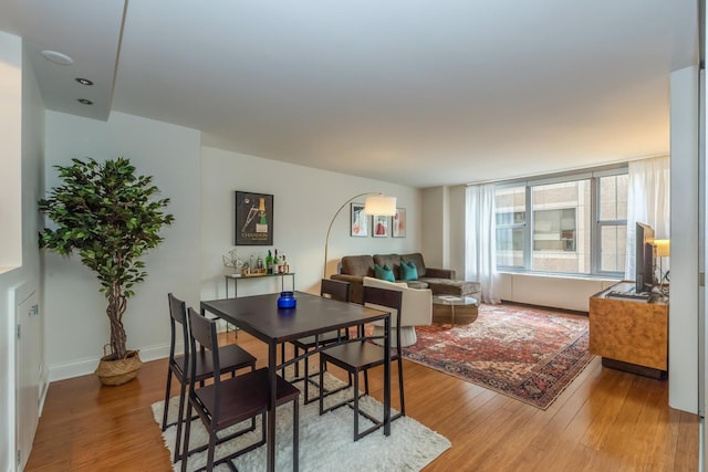 dining space featuring hardwood / wood-style floors