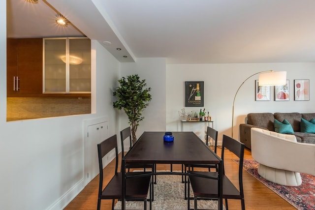 dining space featuring hardwood / wood-style floors