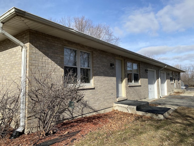 view of property exterior with a garage