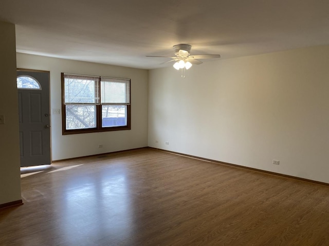 interior space featuring ceiling fan and dark hardwood / wood-style flooring