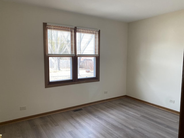 spare room with light wood-type flooring