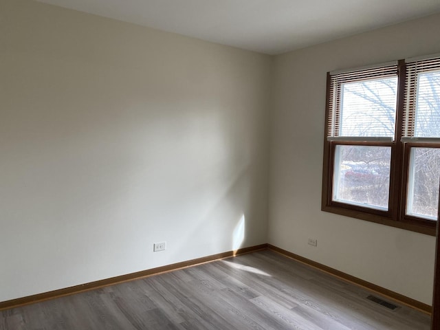 spare room with light wood-type flooring