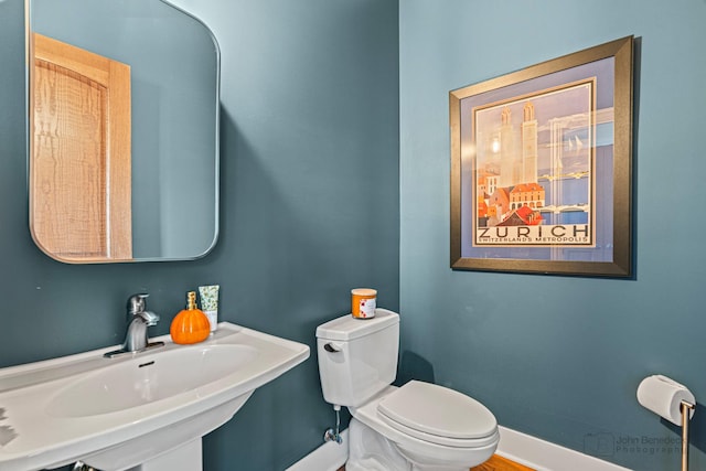 bathroom featuring sink and toilet