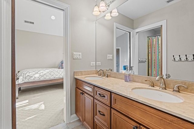 bathroom featuring tile patterned floors and vanity