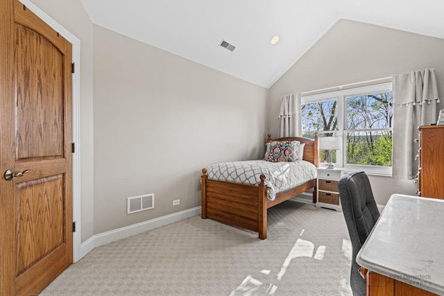 carpeted bedroom featuring lofted ceiling