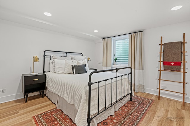 bedroom with hardwood / wood-style flooring