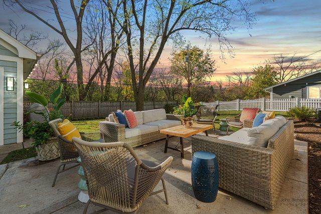 patio terrace at dusk with an outdoor living space