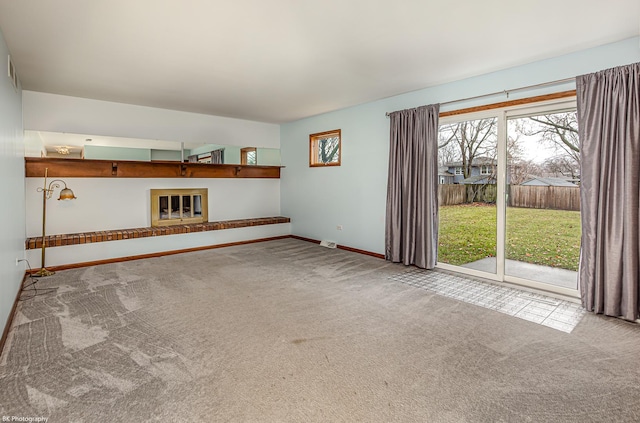 unfurnished living room featuring carpet