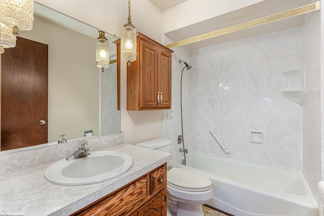 full bathroom featuring tiled shower / bath, vanity, and toilet