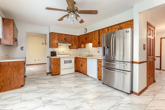 kitchen with ceiling fan, white appliances, and sink