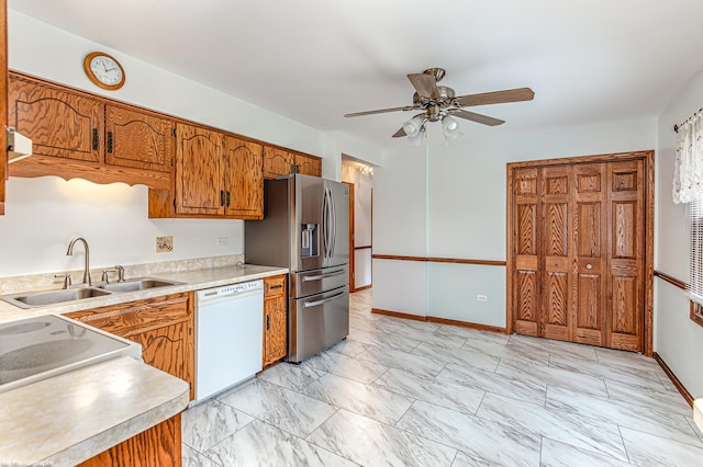 kitchen with stainless steel refrigerator with ice dispenser, dishwasher, sink, and ceiling fan