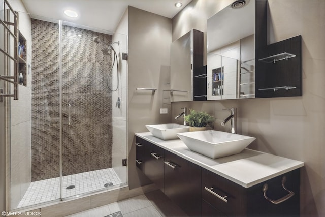 bathroom featuring vanity and a shower with shower door