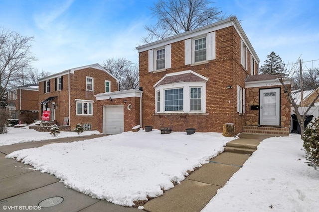 view of front of house featuring brick siding and an attached garage