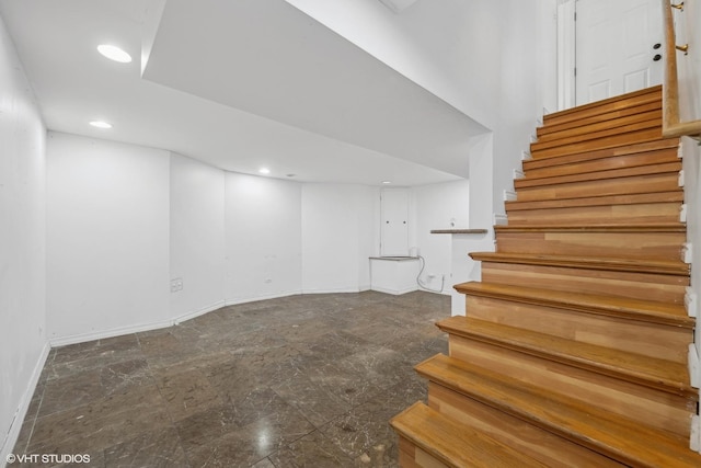 stairway featuring recessed lighting and baseboards