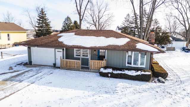 ranch-style house with a garage and covered porch